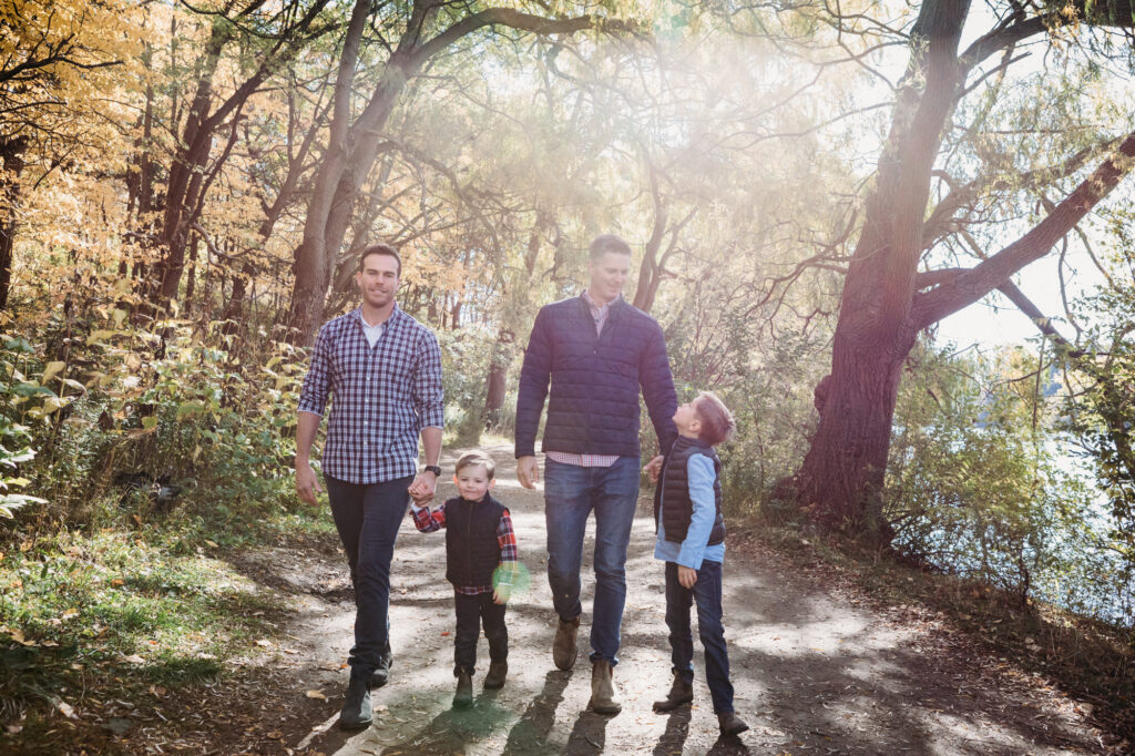 colour photo of family of 4 walking together in high park, toronto