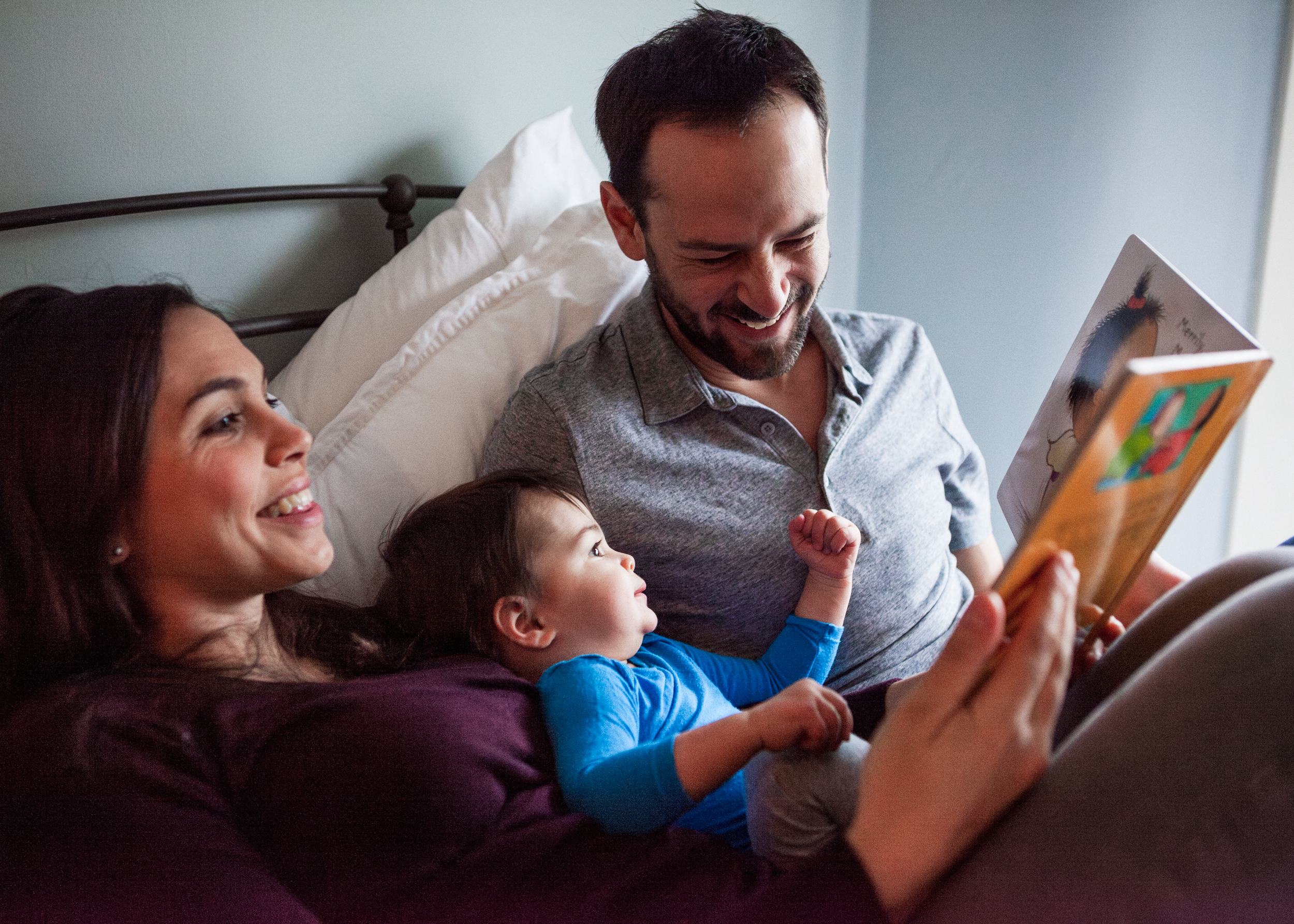 family reading in bed
